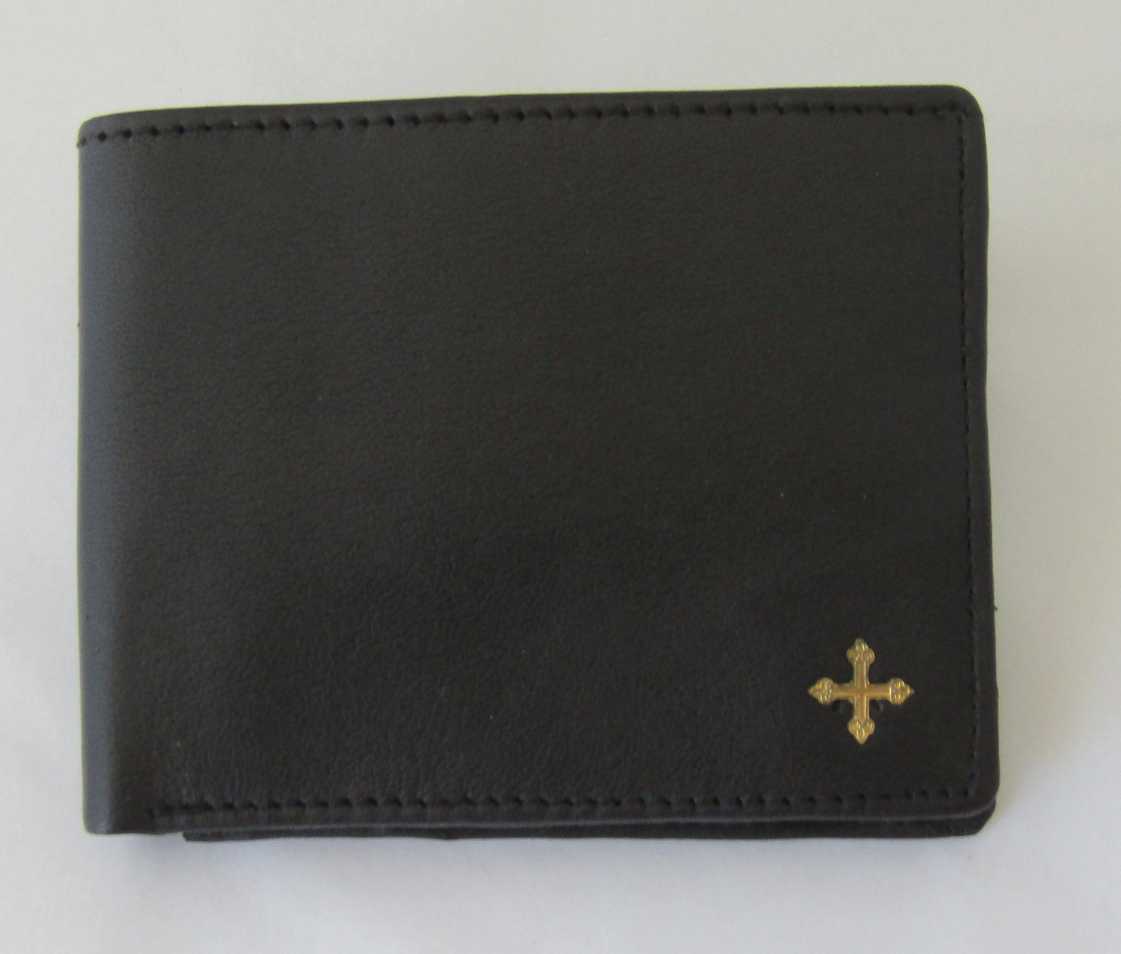 mds#9550/BC. Brass cross on a leather wallet.