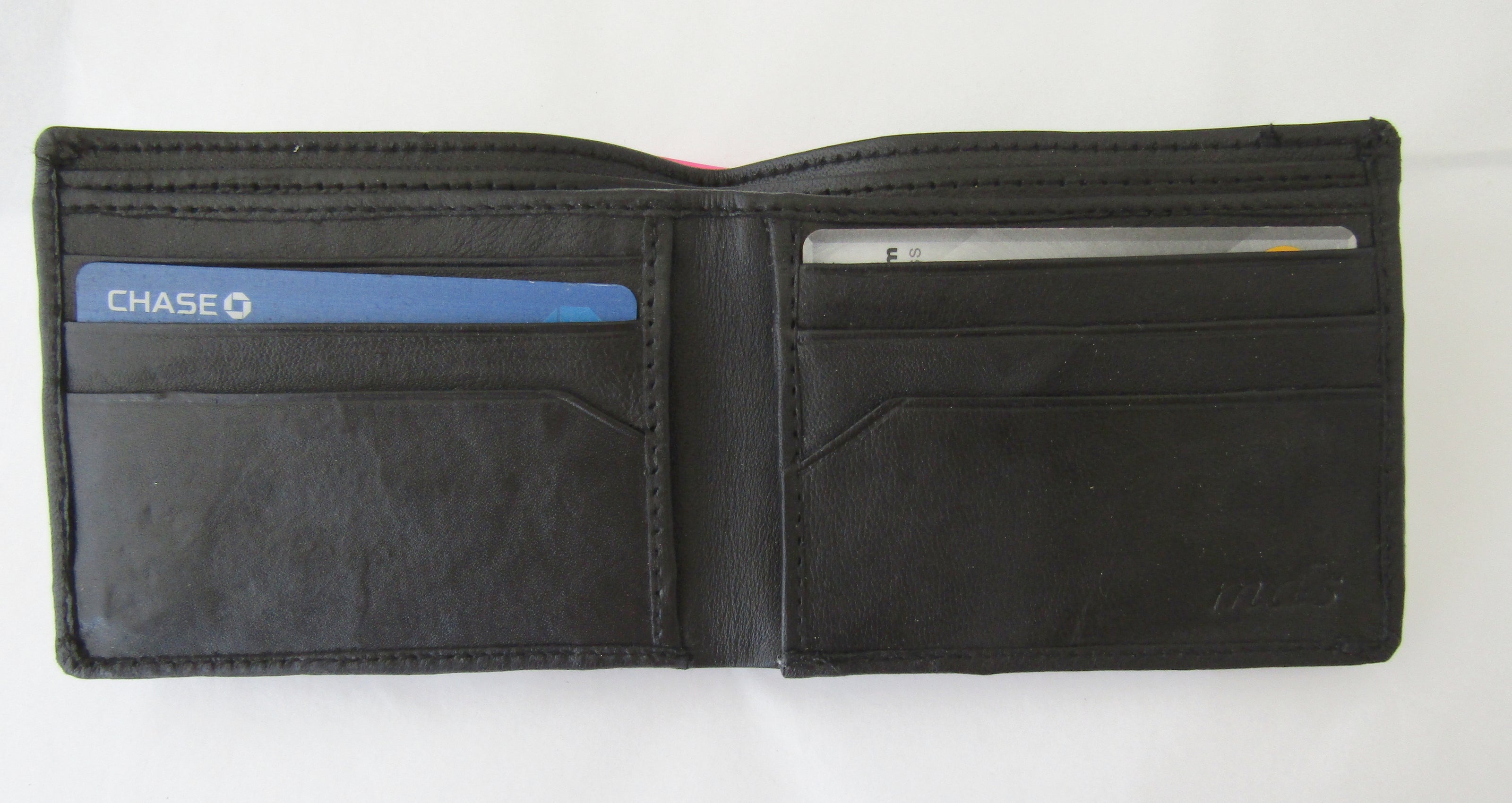 mds#9550/BC. Brass cross on a leather wallet.